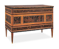 Thumbnail of A pair of Italian early 19th century rosewood, ebony, purplewood, sycamore marquetry and chequer-inlaid commodes all'antica by Karl Amadeus Roos (1775-1837)  (2) image 1