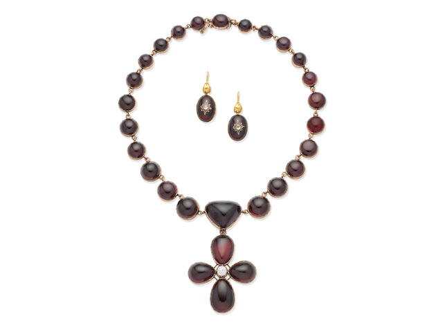 A mid-19th century garnet and diamond necklace and pendant suite and a pair of mid-19th century garnet and diamond earrings (3)