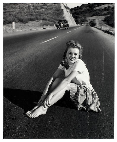 Andre de Dienes (Romanian/American, b.1913-d.1985): a silver gelatin print of a young Marilyn Monroe 'Life on the Road', 1945, printed 2006,