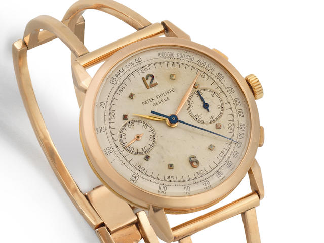 Patek Philippe. A fine and rare 18K rose gold manual wind chronograph bracelet watch Ref: 1579, Sold 19th January 1954