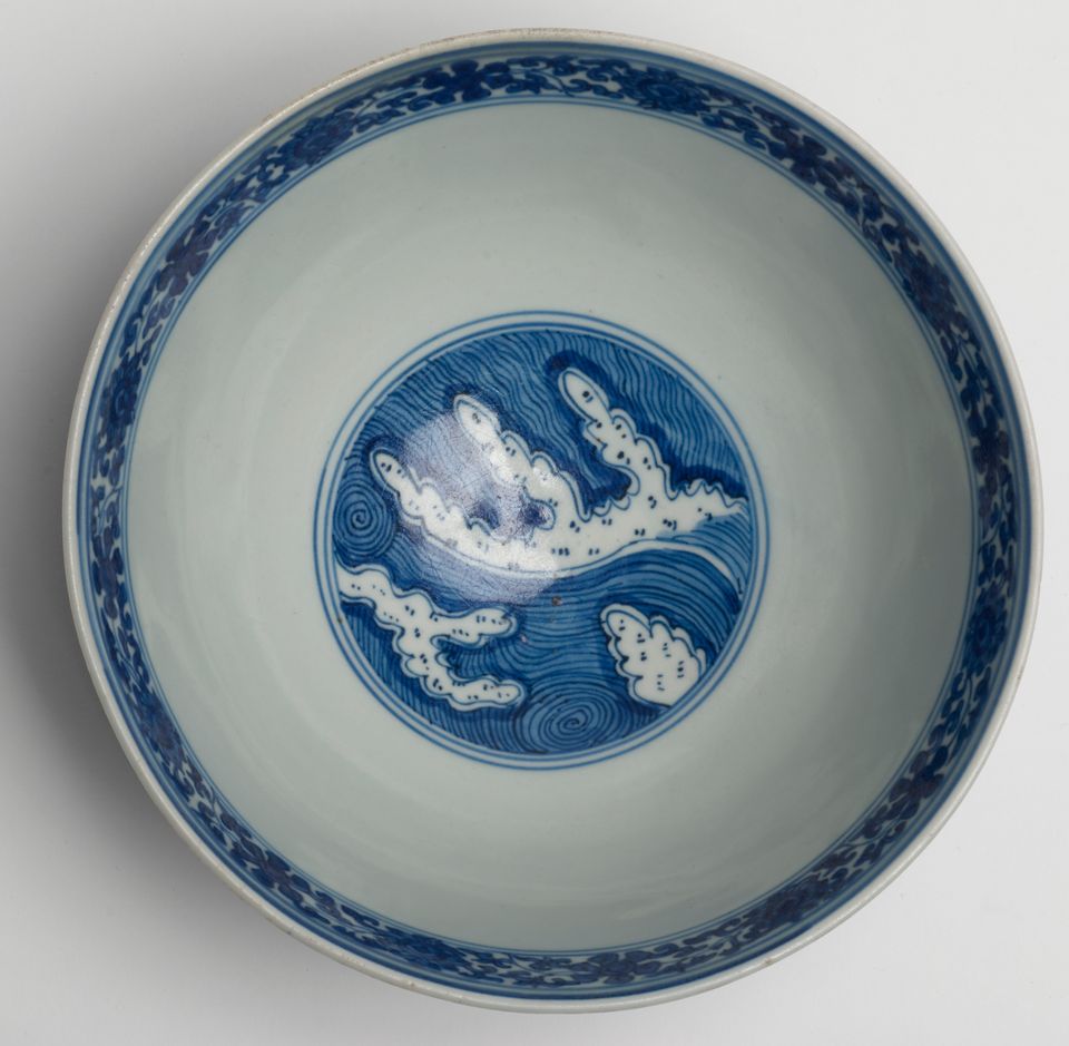 A rare blue and white 'waves and flowers' bowl Wanli six-character mark and of the period