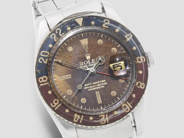 Rolex. A fine stainless steel automatic calendar dual time wristwatch with bakelite bezel  GMT Master, Ref: 6542, Circa 1959