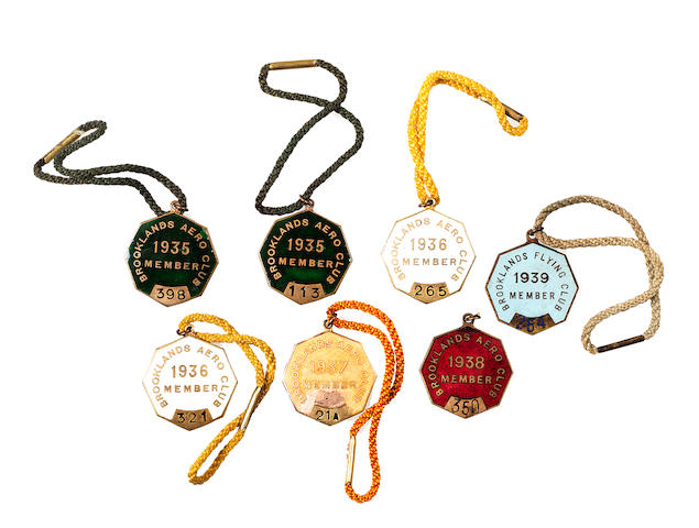 Seven scarce Brooklands Aero Club member's enamel lapel badges 1936-1939,  ((7))