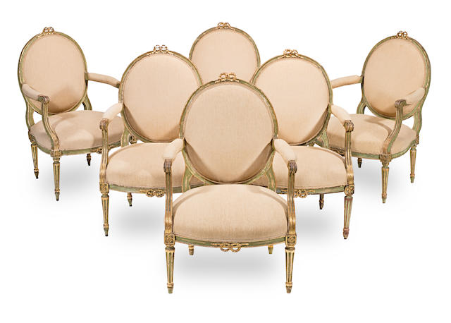 A set of six Louis XVI painted and parcel gilt fauteuils in the manner of Georges Jacob (6)
