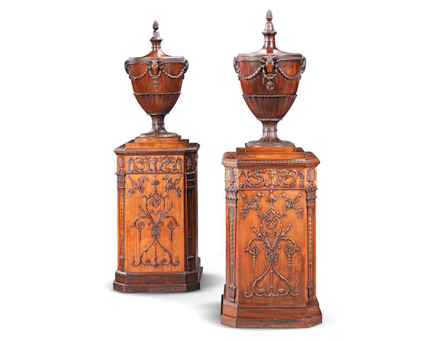 A matched pair of satinwood and carved mahogany urns and pedestals one urn and pedestal circa 1775, the other of a later date but probably 19th century (2)
