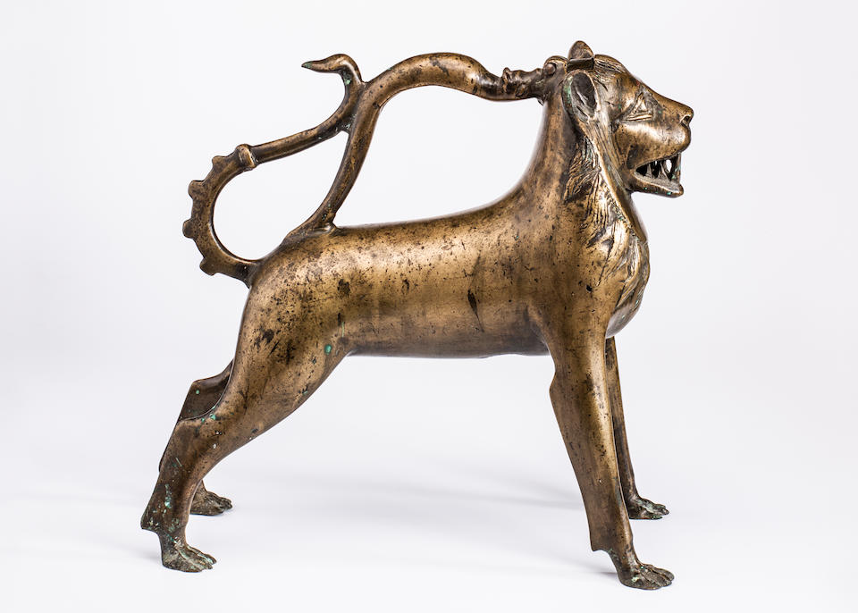 A rare 14th century German bronze Aquamanile in the form of a lion L&#252;beck or Nuremberg, circa 1350