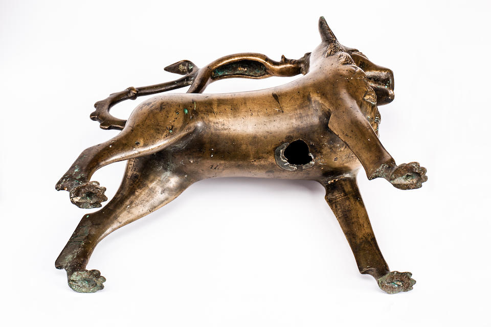 A rare 14th century German bronze Aquamanile in the form of a lion L&#252;beck or Nuremberg, circa 1350