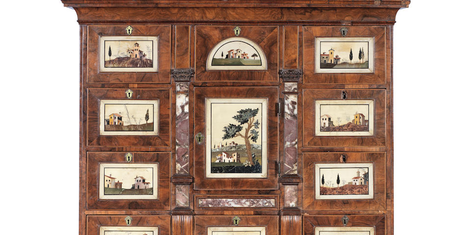 An important early 18th century walnut and marble mounted cabinet on stand inset with eleven Italian pietra dura and pietra paesina tablets the Italian tablets late 17th/early 18th century, the cabinet work circa 1720 and either English or German in origin