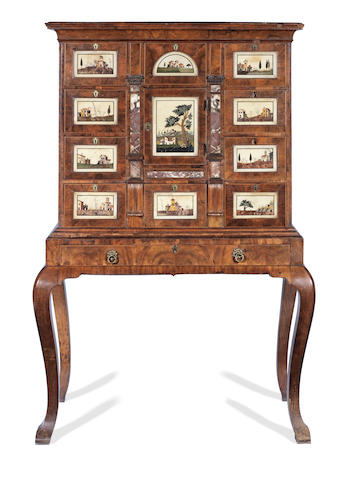 An important early 18th century walnut and marble mounted cabinet on stand inset with eleven Italian pietra dura and pietra paesina tablets the Italian tablets late 17th/early 18th century, the cabinet work circa 1720 and either English or German in origin