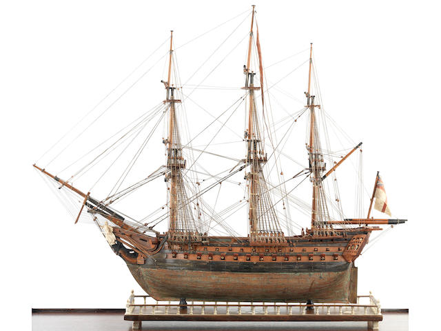 A fine Prisoner-of-War boxwood model of the first class ship of the line HMS Foudroyant,  early 19th century,  the case 76 x 89 x 39cm (30 x 35 x 15 1/2in).