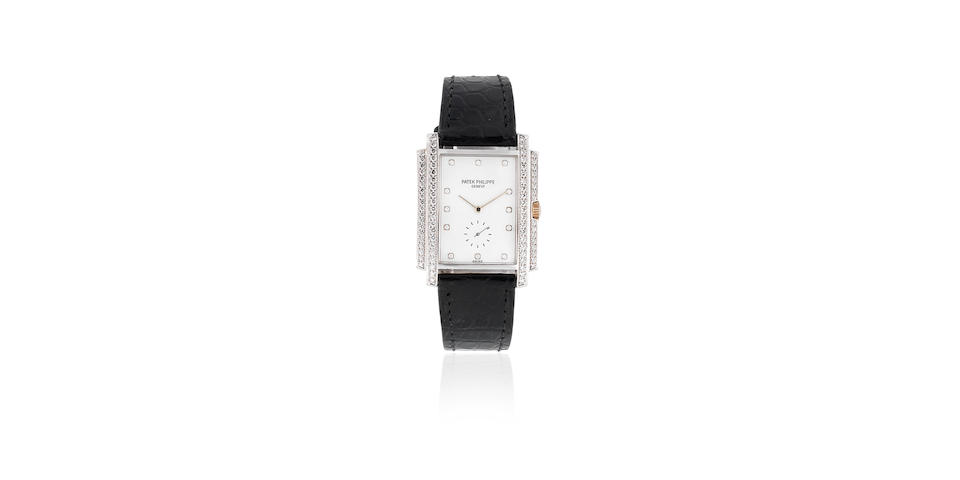 Patek Philippe. An 18K white gold and diamond set manual wind rectangular wristwatch  Gondolo, Ref: 5025G-001, Manufactured 2001, Purchased 17th January 2002
