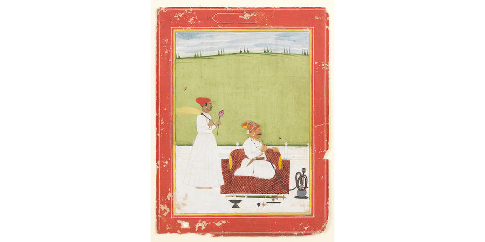 A NOBLEMAN SMOKING A HOOKAH SEATED ON A TERRACE, A SERVANT STANDING FACING LEFT HOLDING A MORCHAL AND A LOTUS BLOOM JAIPUR, CIRCA 1760