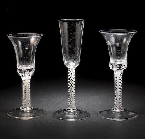 Two similar opaque twist wine glasses and an ale flute, circa 1765