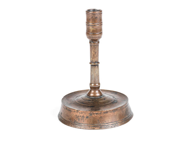 A rare 15th century copper alloy candlestick  English, circa 1400-1500