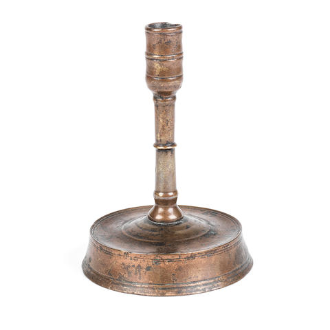A rare 15th century copper alloy candlestick  English, circa 1400-1500