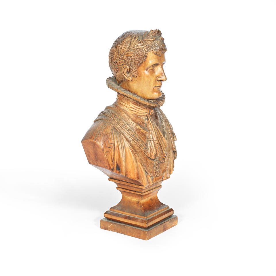 A mid 19th century carved and polished fruitwood bust of Napoleon depicted as Emperor, Signed Pouchard and dated 1840