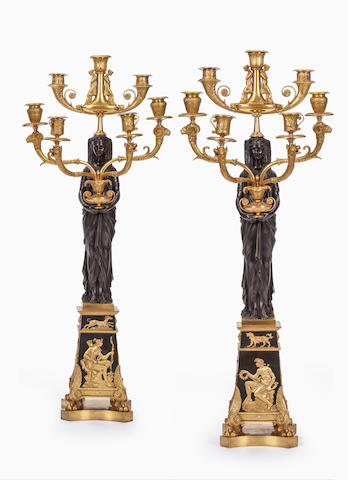 A pair of fine and impressive Empire 'Retour D'Egypt' gilt and patinated bronze seven light figural candelabra Possibly attributable to Pierre-Philippe Thomire, early 19th century (2)