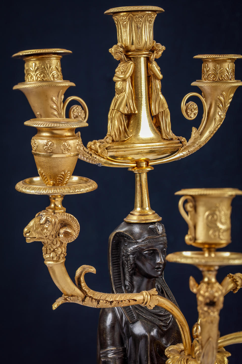 A pair of fine and impressive Empire 'Retour D'Egypt' gilt and patinated bronze seven light figural candelabra Possibly attributable to Pierre-Philippe Thomire, early 19th century (2)