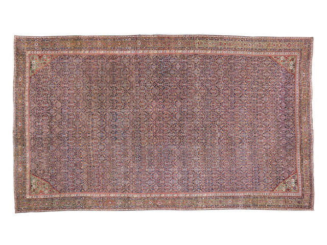 An exceptionally large Fereghan carpet West Persia 1014cm x 623cm