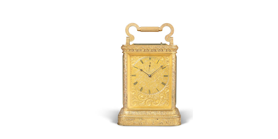 An exceptionally fine engraved gilt brass English giant carriage clock with running seconds indication and fully relief-engraved case.  Together with two travel cases. James McCabe, Royal Exchange, London, No.2671 3