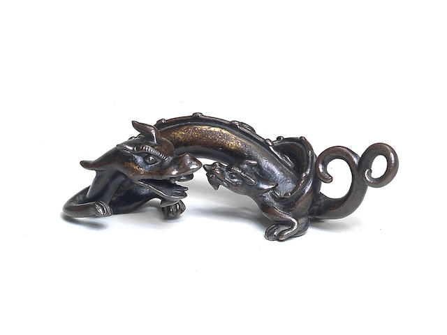 A PARCEL-GILT BRONZE 'DRAGON AND YOUNG' BRUSHREST  Ming Dynasty