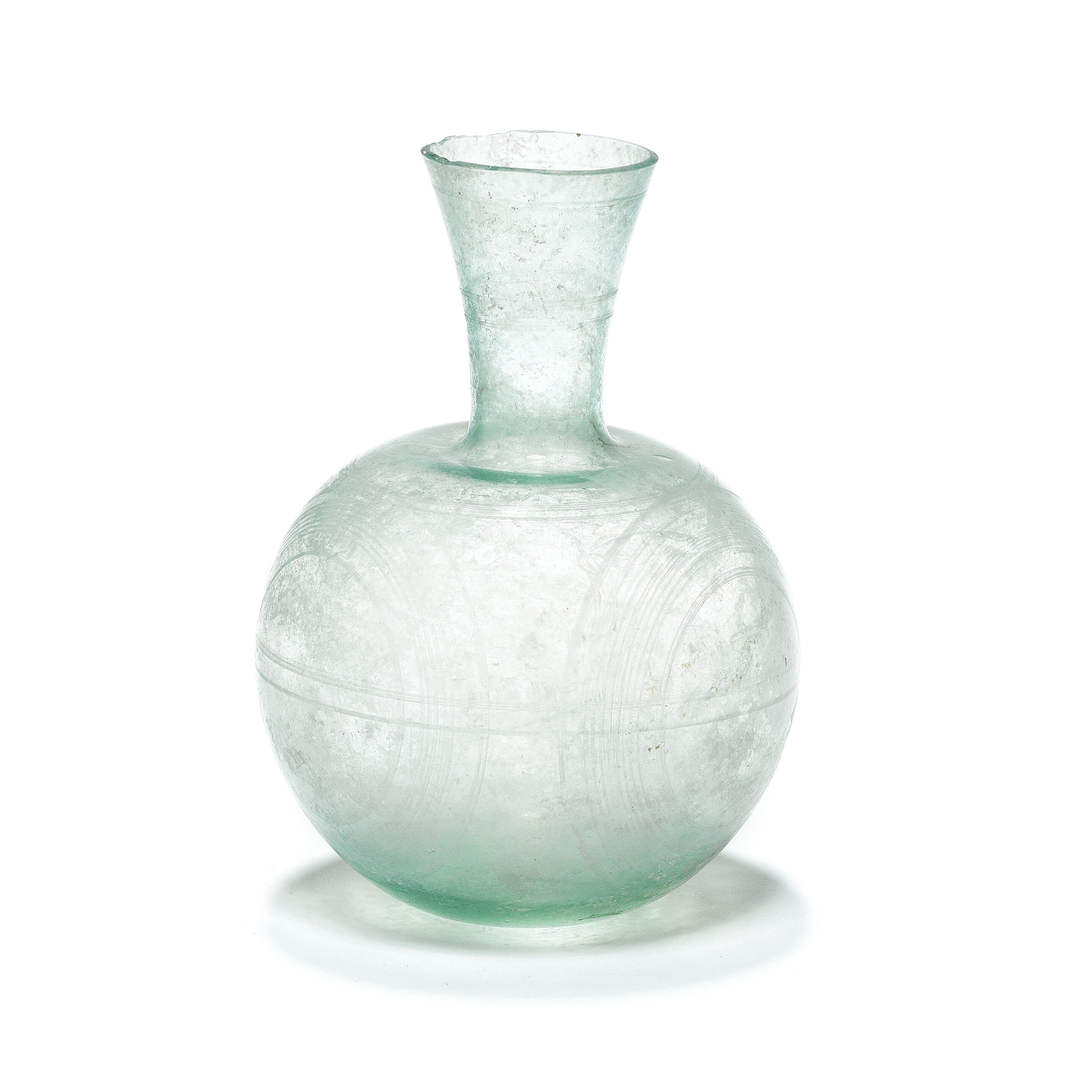 A Roman pale green wheel engraved glass flask