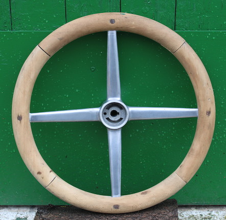 A wood rimmed steering wheel, image 1