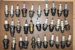 Thumbnail of A collection of sparkplugs and related tins and boxes,  (Qty) image 3