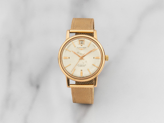 Longines. Montre bracelet en or jaune 18K (750) avec date mouvement automatique Longines. An 18K gold automatic calendar bracelet watch   Conquest, Ref 9025.9.198, Circa 1961 image 1