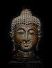 Thumbnail of A LARGE COPPER ALLOY HEAD OF BUDDHA NORTHERN THAILAND, LAN NA KINGDOM, 15TH CENTURY image 1