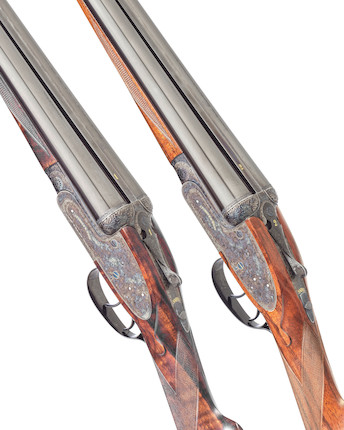A fine pair of Tallet-engraved 12-bore self-opening sidelock ejector guns by J. Purdey & Sons, no. 29621/2 In their leather motorcase with canvas cover In their leather motorcase with canvas cover image 3