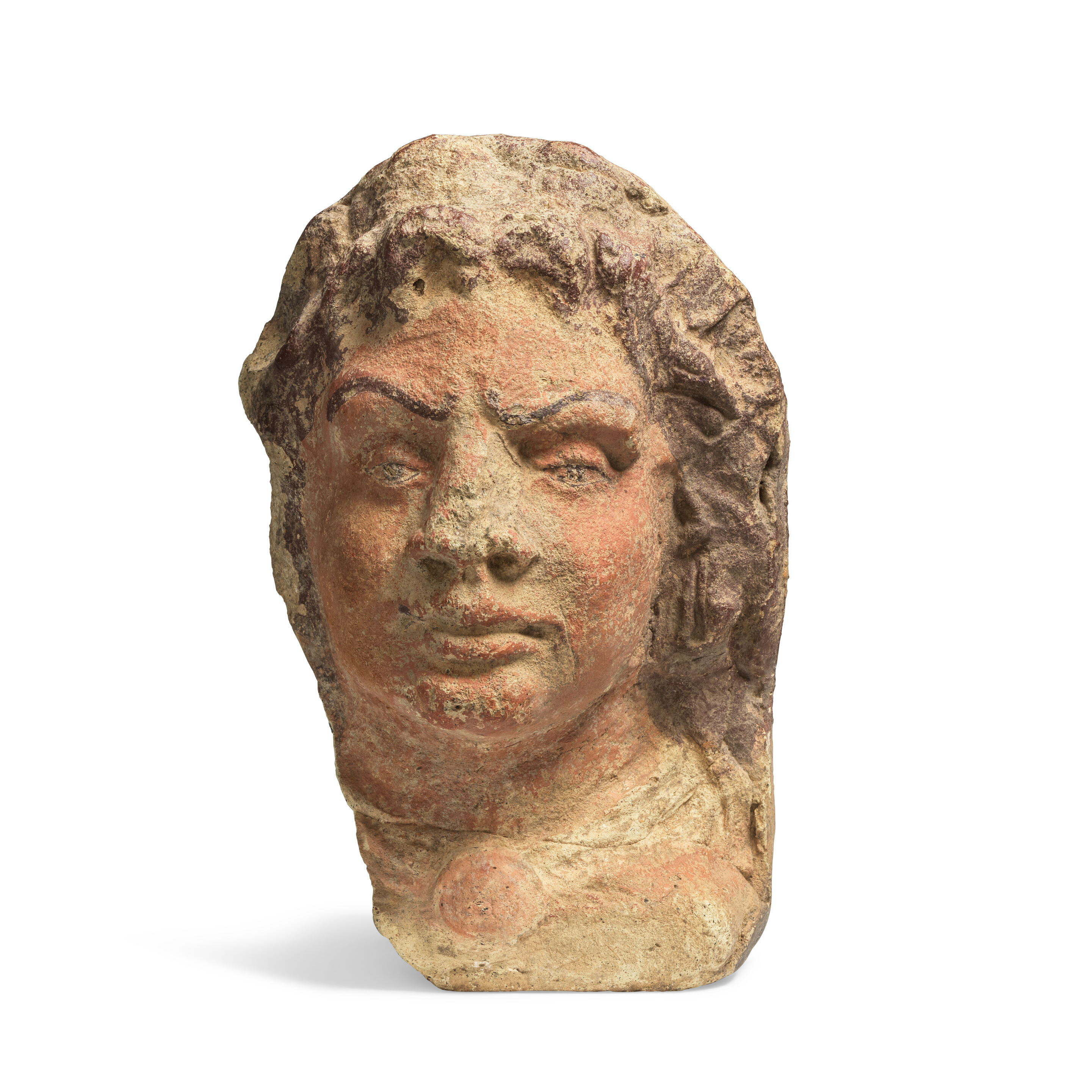 An Etruscan terracotta antefix of a satyr