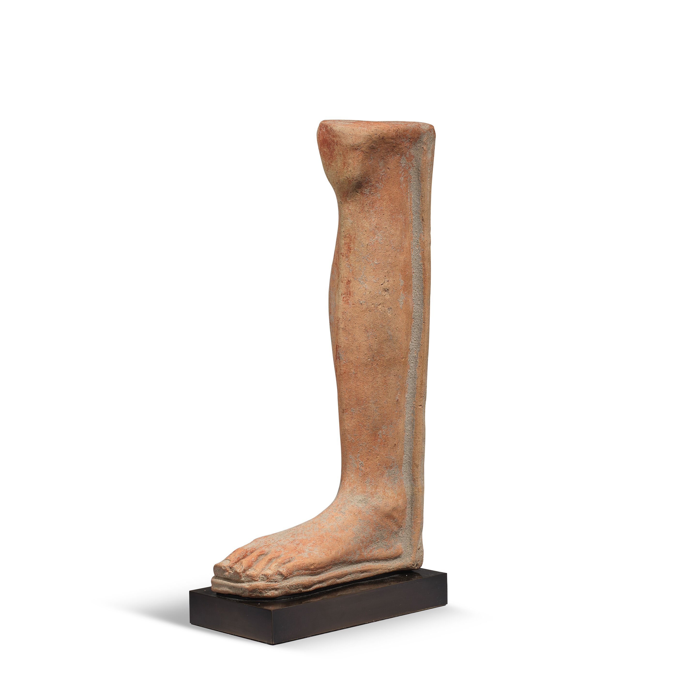 An Etruscan terracotta votive life-size left leg