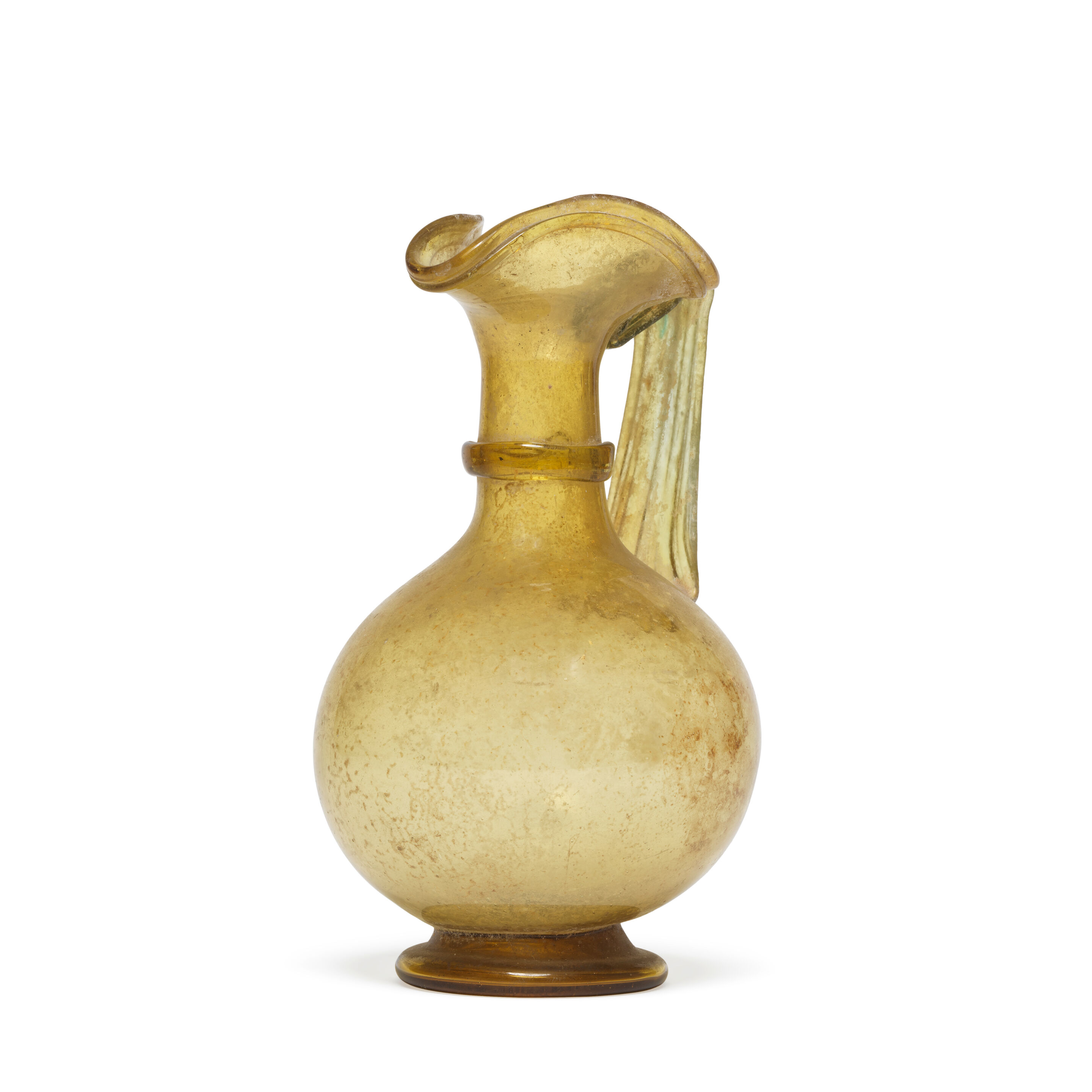 A Roman yellow glass jug