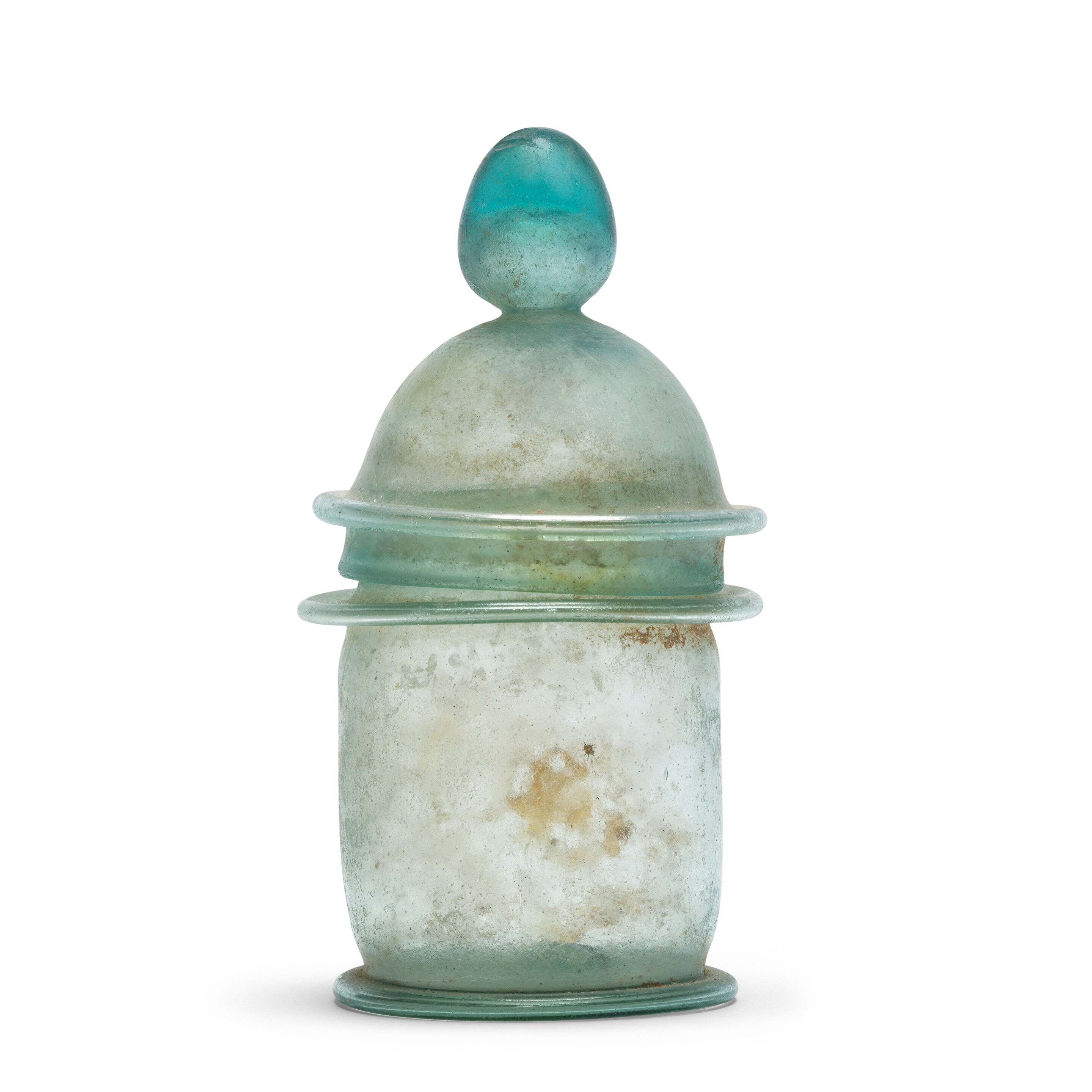 A Roman bright turquoise glass lidded pyxis