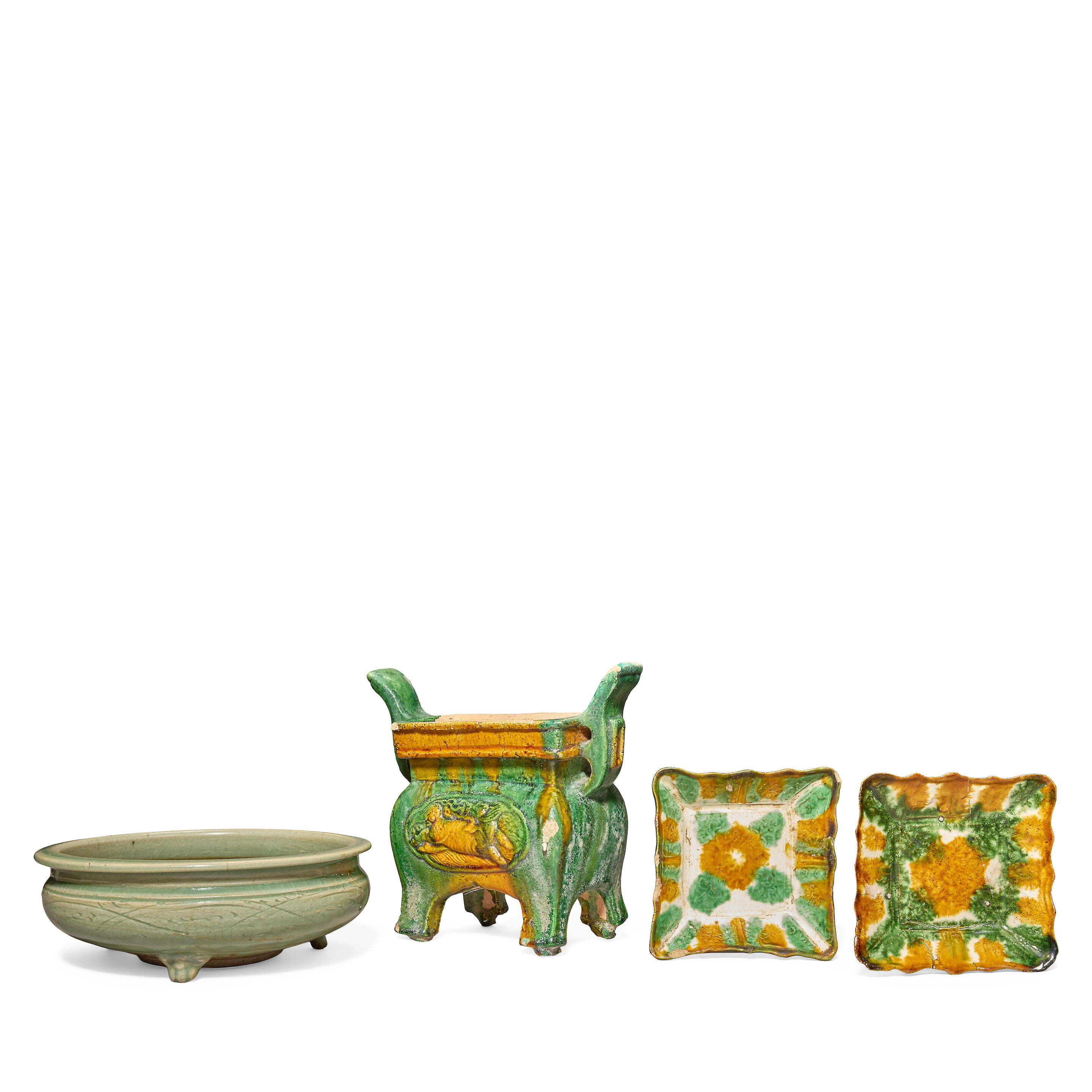 A SANCAI POTTERY INCENSE BURNER, A PAIR OF SANCAI GLAZED SQUARE DISHES AND A LONGQUAN CELADON INCENSE BURNER Liao and Ming Dynasty