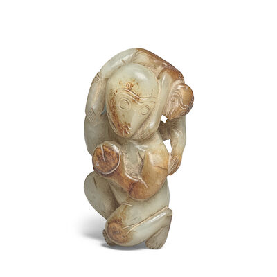 A PALE GREEN AND RUSSET JADE 'MONKEY AND PEACH' GROUP 19th century