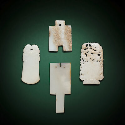 A GROUP OF FOUR WHITE JADE ARCHAISTIC PLAQUES Qing Dynasty and later (4)