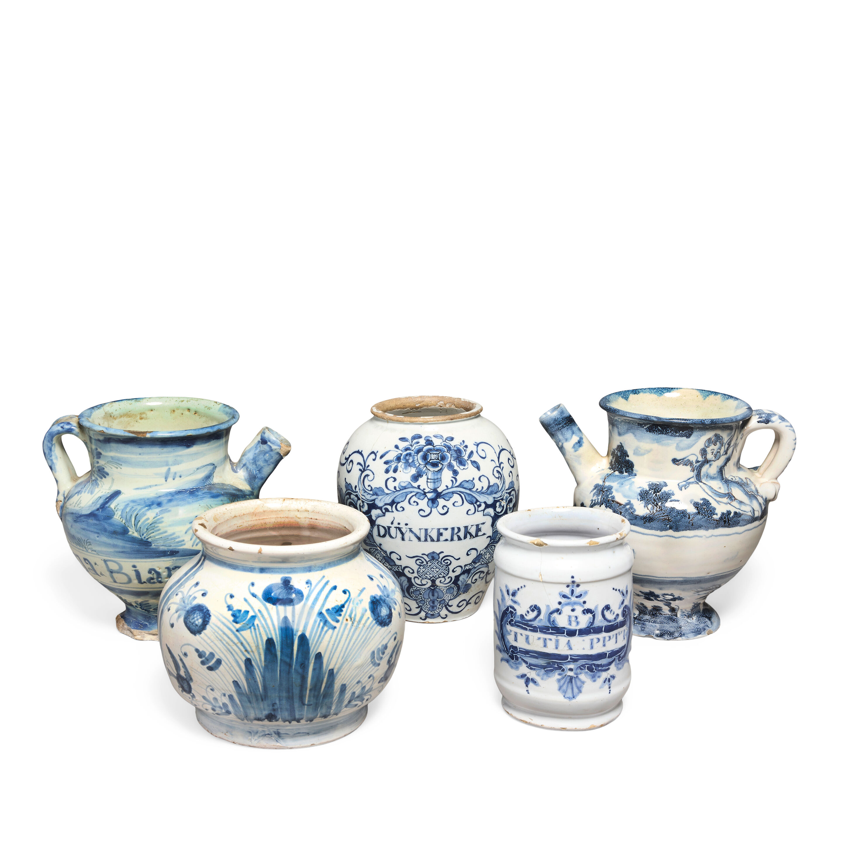 A collection of five Continental blue and white tin glazed earthenware drug jars 18th century and later, all as found