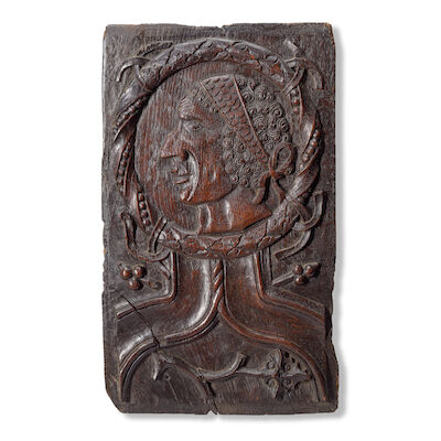 A unique first half 16th century English carved oak 'Romayne' portrait panel of an African gentleman Possibly depicting Jacques Francis (c. 1527-1548) the Mary Rose salvage diver