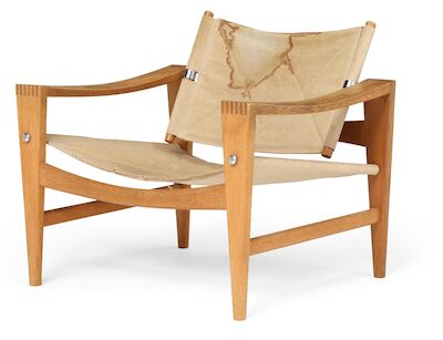 Hans J. Wegner: "Bukkestol". An oak easy chair with steel fittings. Seat and back with sand-coloured canvas. "Bukkestol". An oak easy chair with steel fittings. Seat and back with sand-coloured canvas. Made 1950-1960s by cabinetmaker Johannes Hansen.